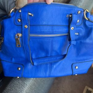 Beautiful and very well kept satchel. Beautiful blue with gold hardware.